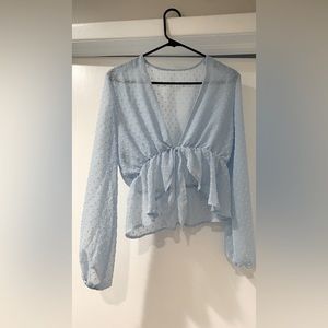 Blue polka dot peplum front tie blouse